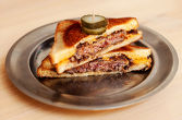 HAMBURGER grilled cheese ----- 100% ground beef, melted english cheddar, caramelized onions, 
МЕАТ’s sauce, butter, brioche bread
